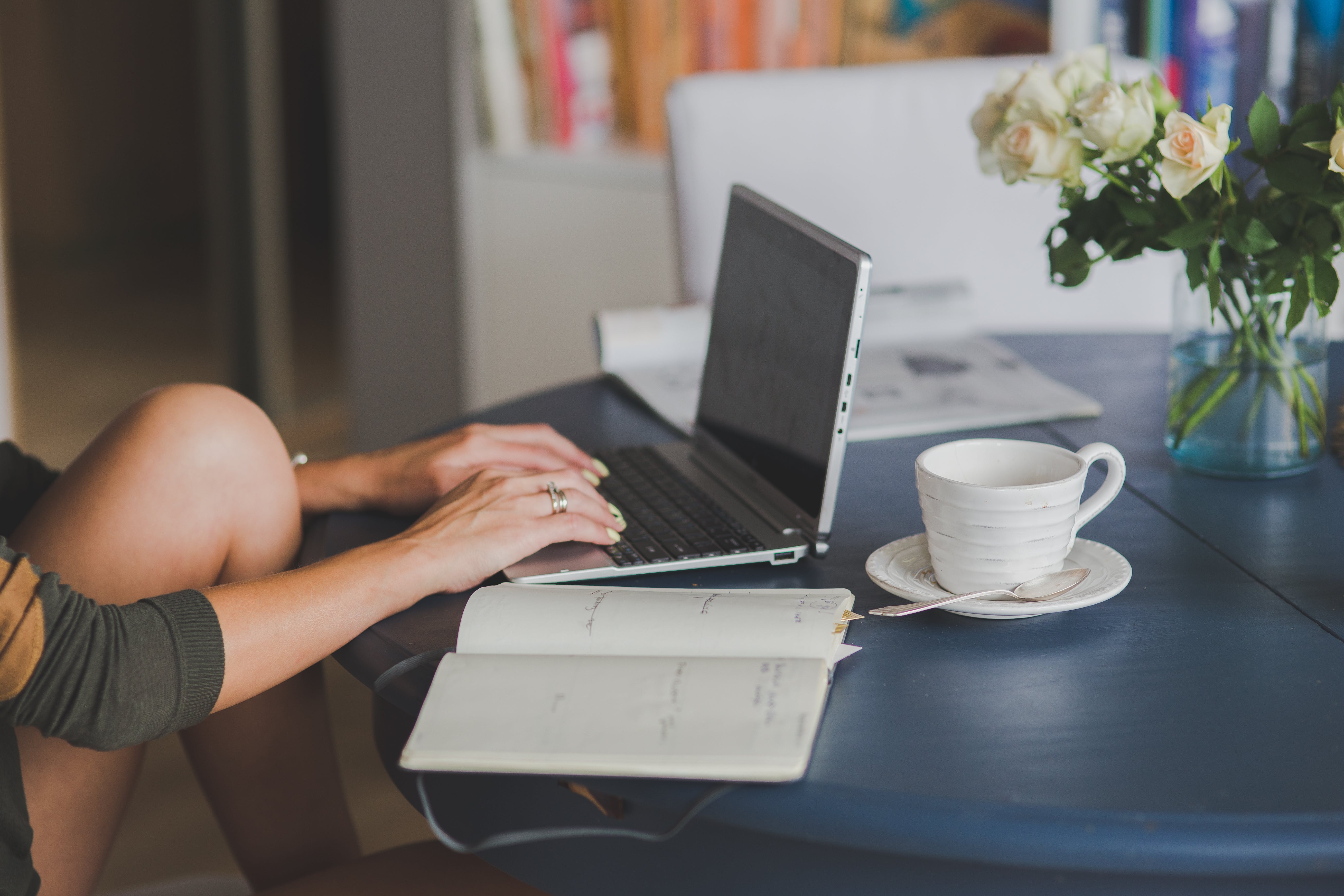 woman learning with laptop coffee and notebook