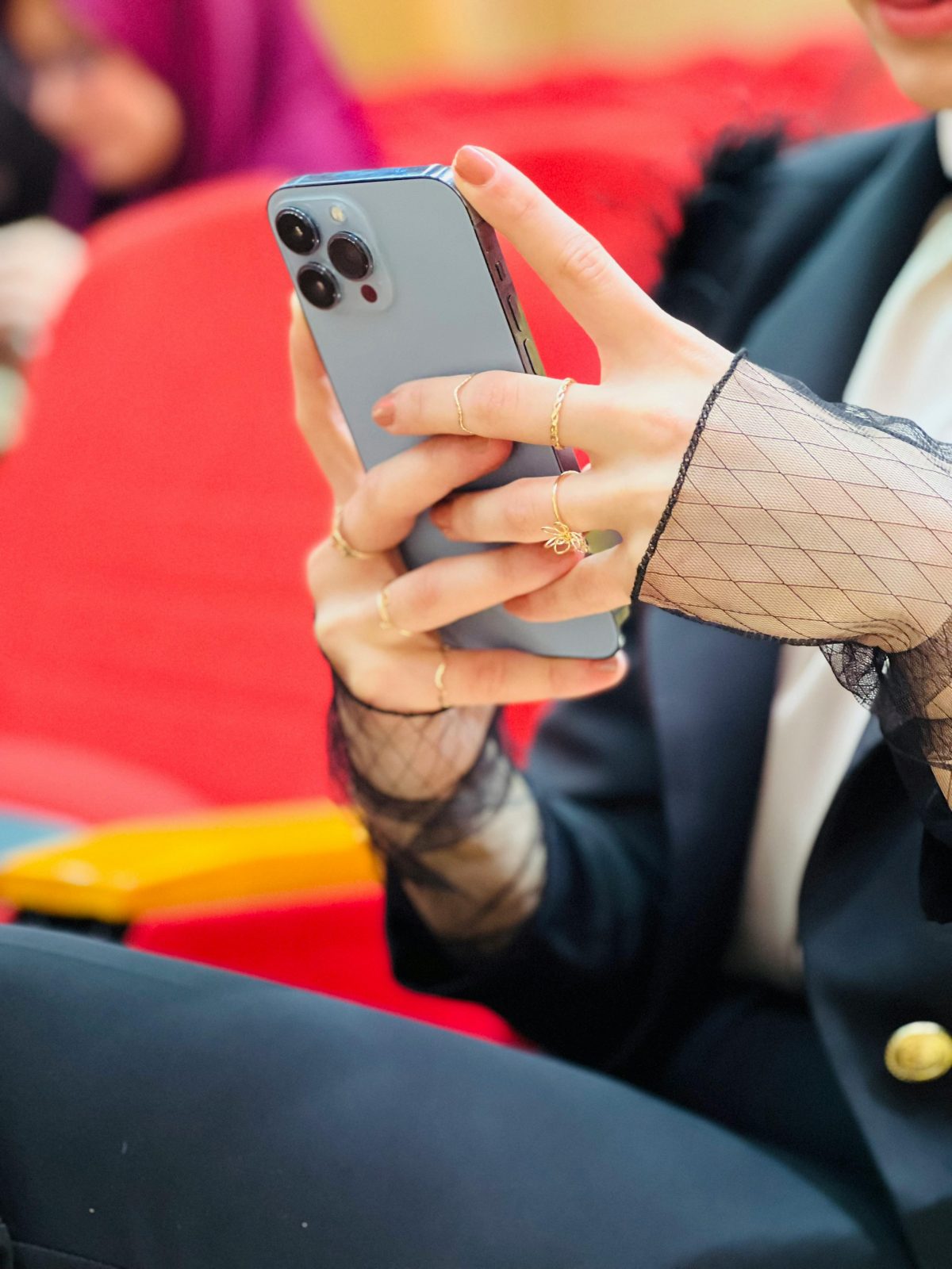 fancy womans hands with phone exploring most innovative apps