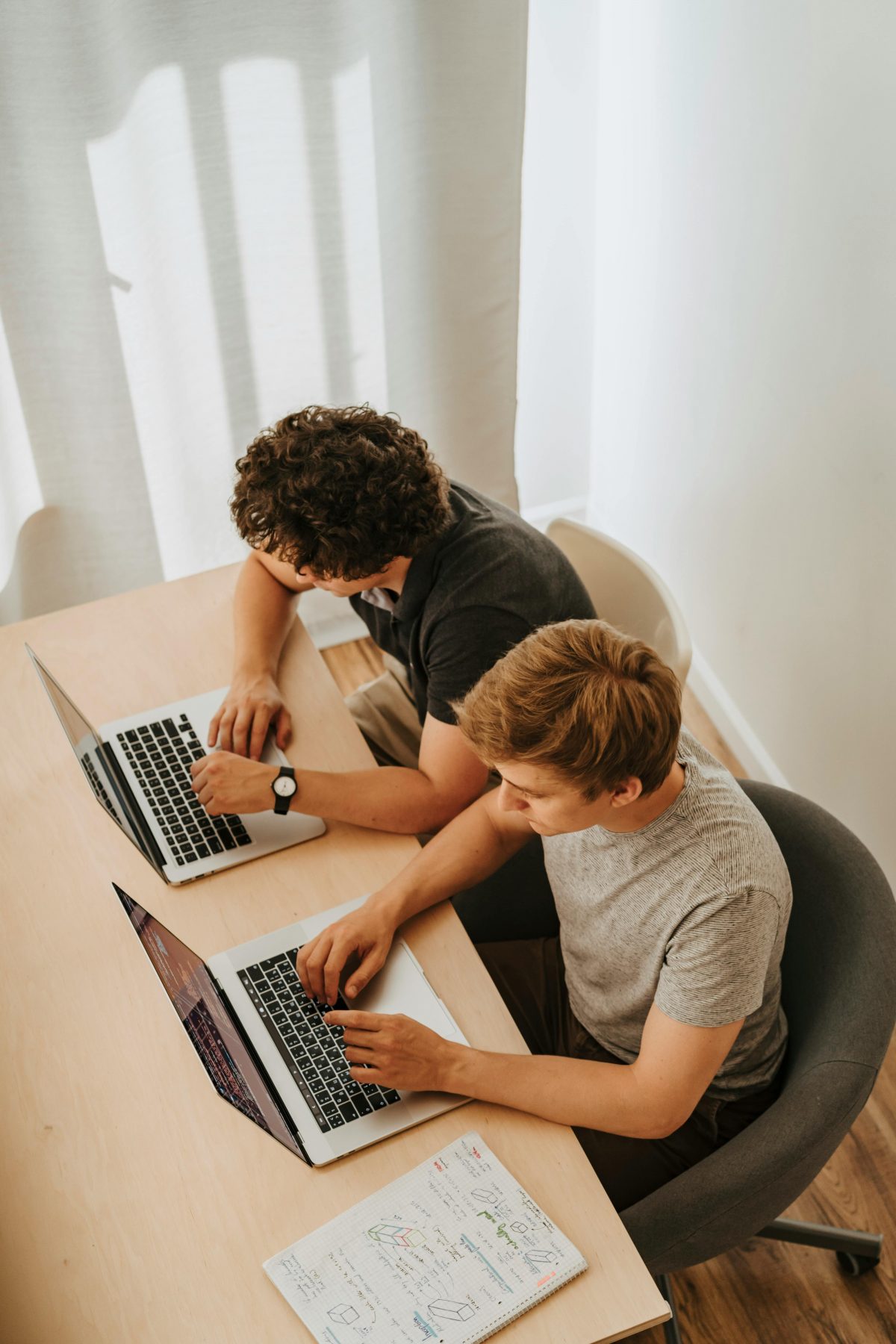 developers two men sitting coding