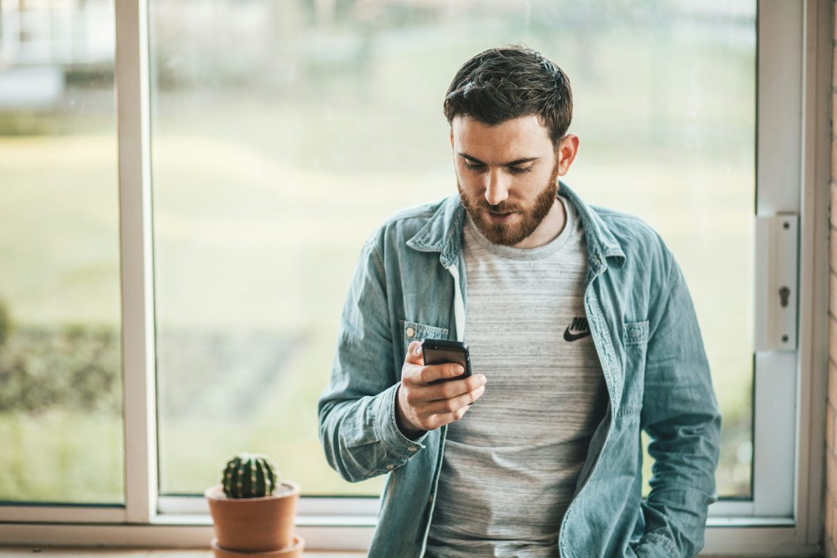 man checking his phone